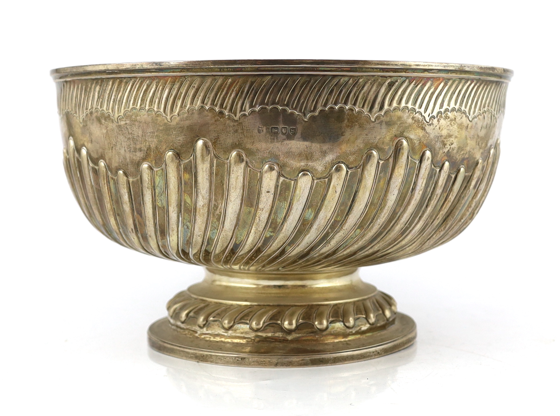 A late Victorian demi fluted silver circular punch bowl, by Goldsmiths & Silversmiths Co. Ltd., diameter 32cm, 42.6oz.